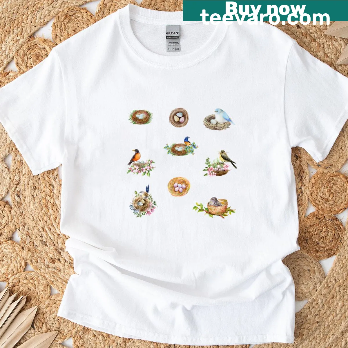 Illustrated T-shirt featuring bird nests and whimsical birds — on a men's t-shirt