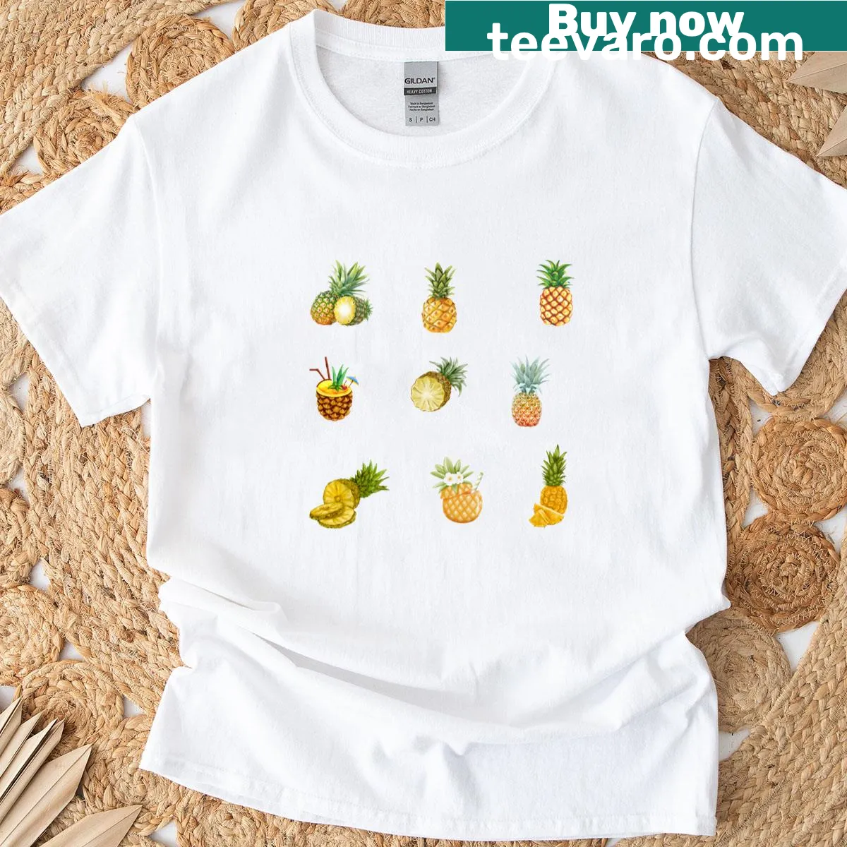 Illustrated T-shirt featuring playful pineapple designs — on a men's t-shirt