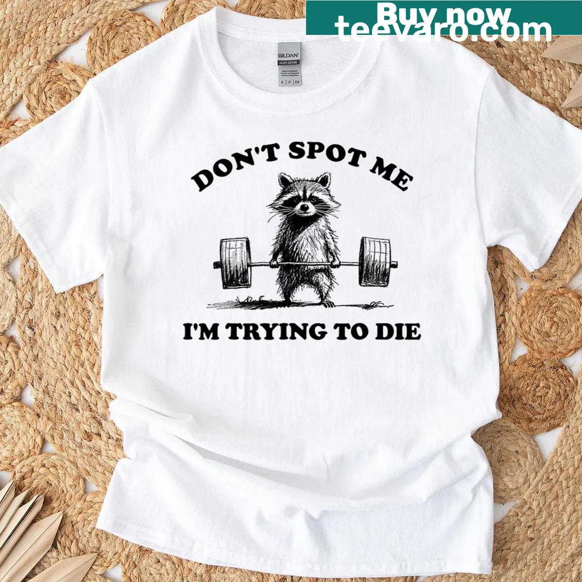 Vintage-style T-shirt featuring a raccoon weightlifter with humorous text — on a men's t-shirt