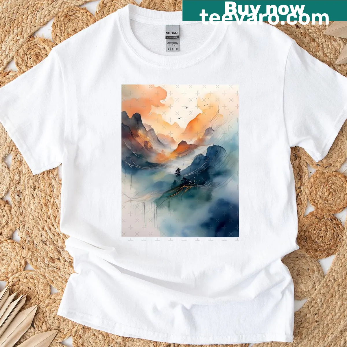 Artistic T-shirt featuring misty mountains and a solitary tree — on a men's t-shirt