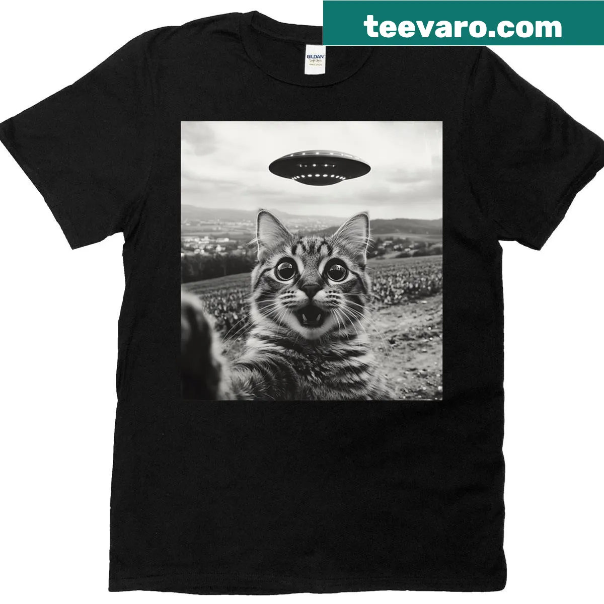 Cartoon cat taking a selfie with a UFO in the background. — on a men's t-shirt
