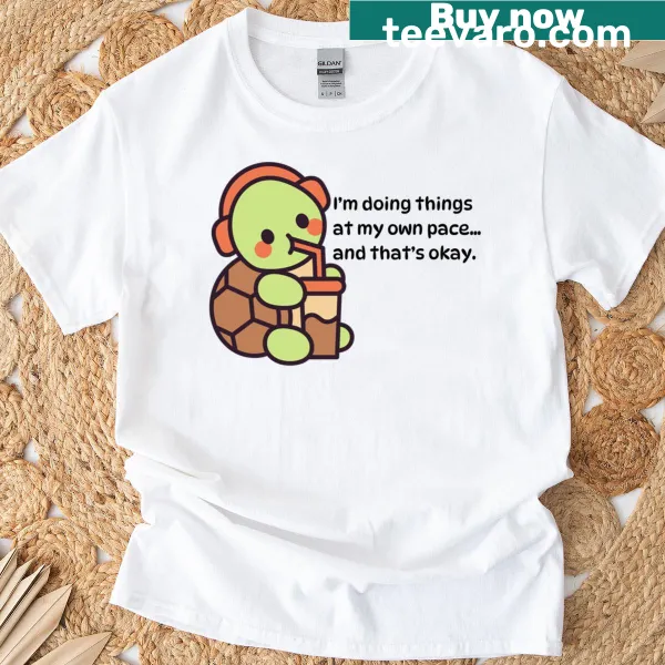 Cute turtle illustration promoting self-compassion on a T-shirt