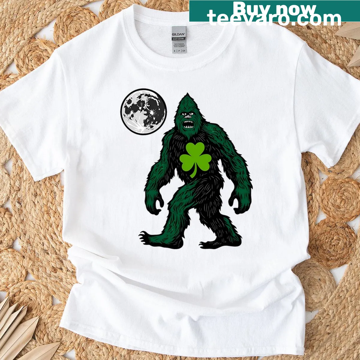 Bigfoot with a shamrock for St. Patrick's Day on a t-shirt — on a men's t-shirt