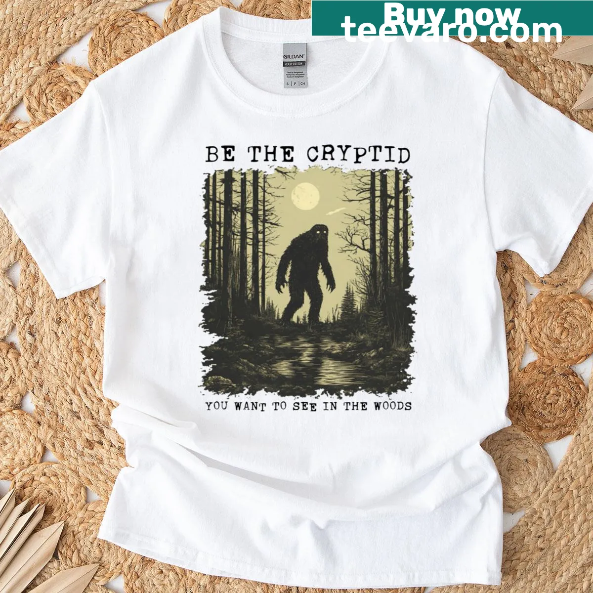Whimsical t-shirt encouraging wearers to embody a cryptid in the woods. — on a men's t-shirt