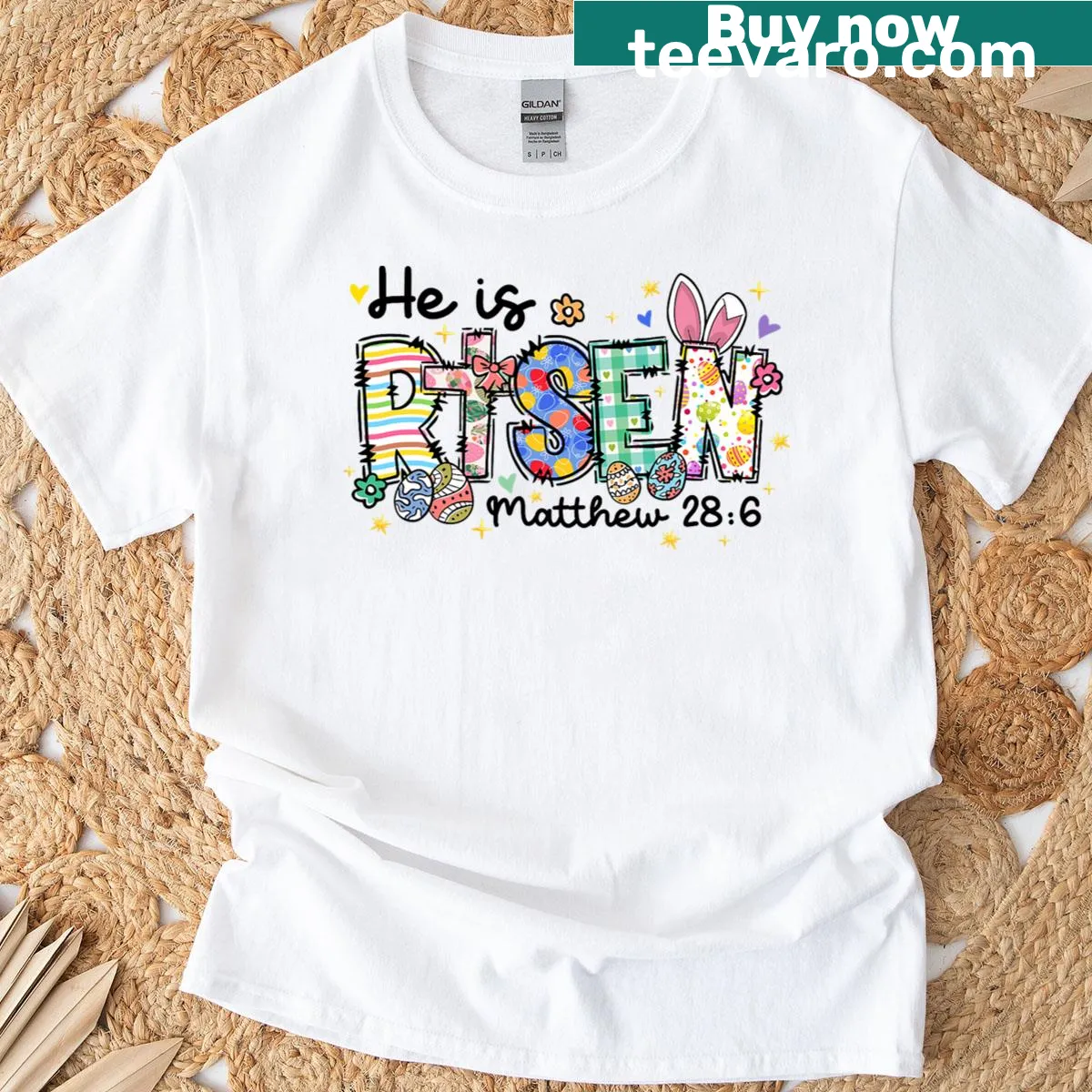 Floral wreath with 'He Is Risen' text on girls' T-shirt — on a men's t-shirt