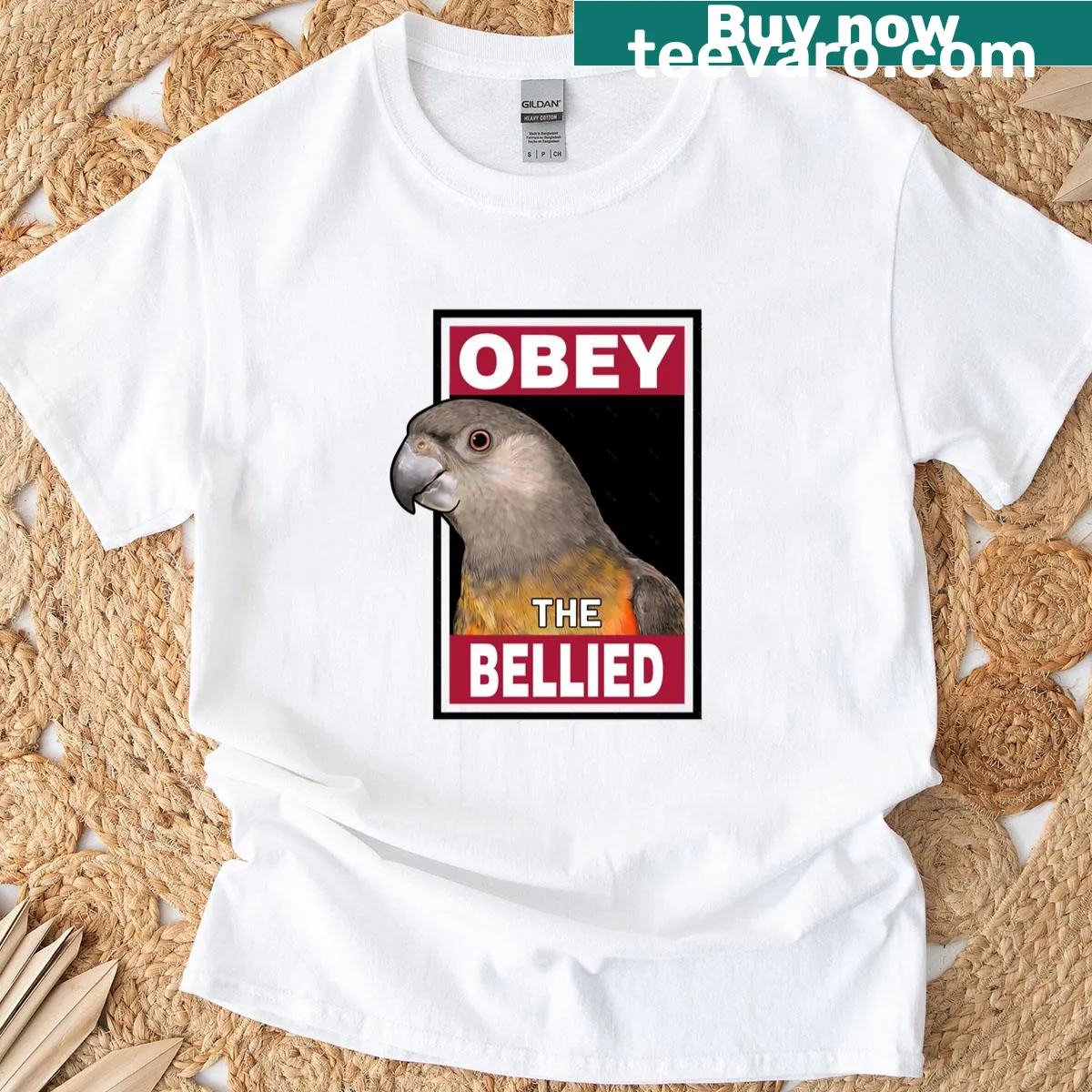 Graphic of a Red Bellied Parrot with 'Obey' text on an orange T-shirt — on a men's t-shirt