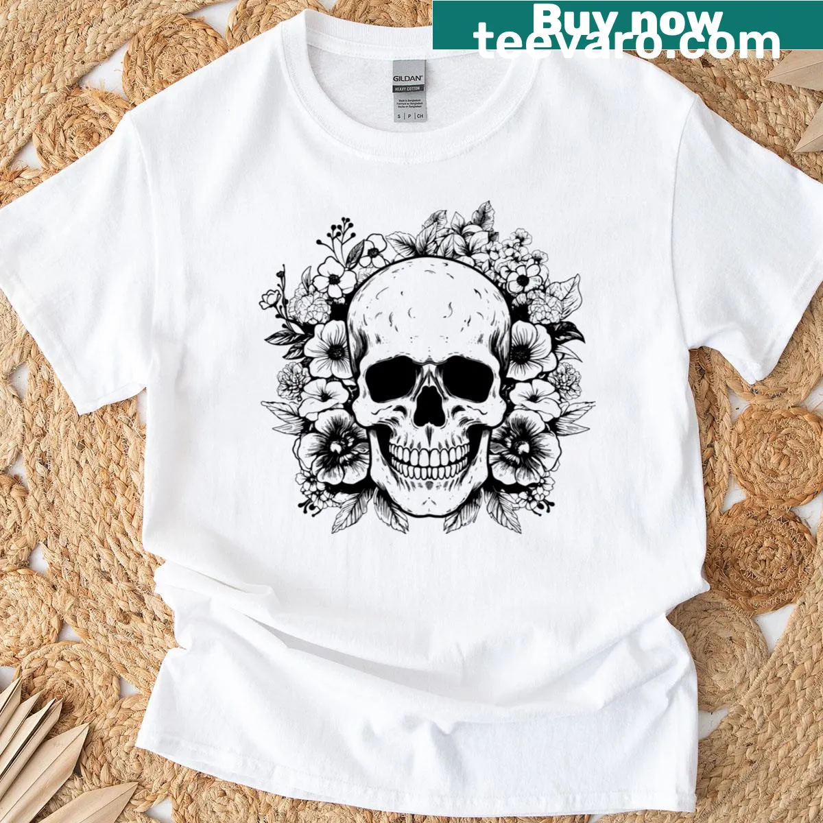 Skull surrounded by floral design — on a men's t-shirt