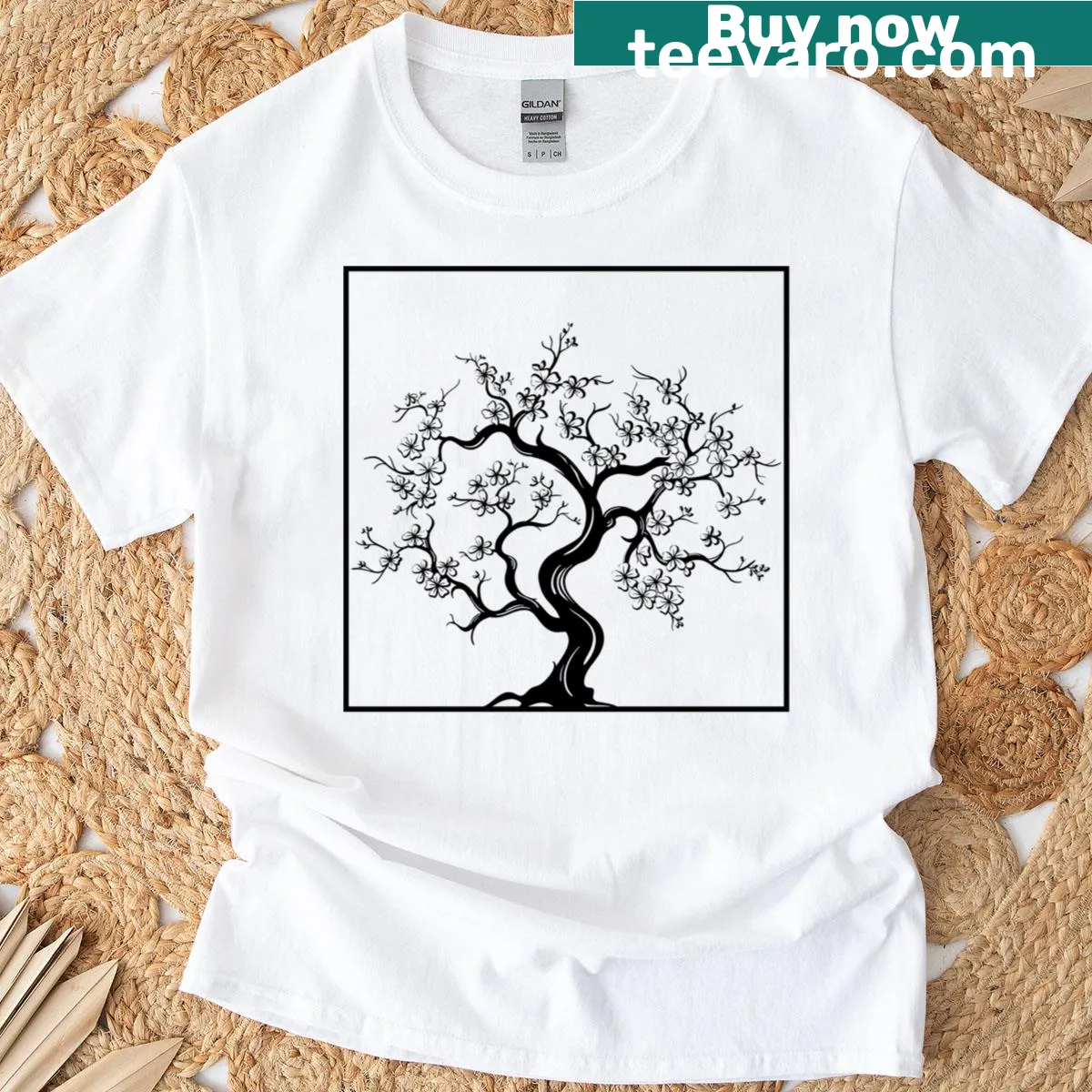 Sakura tree illustration on a T-shirt, symbolizing beauty and renewal. — on a men's t-shirt