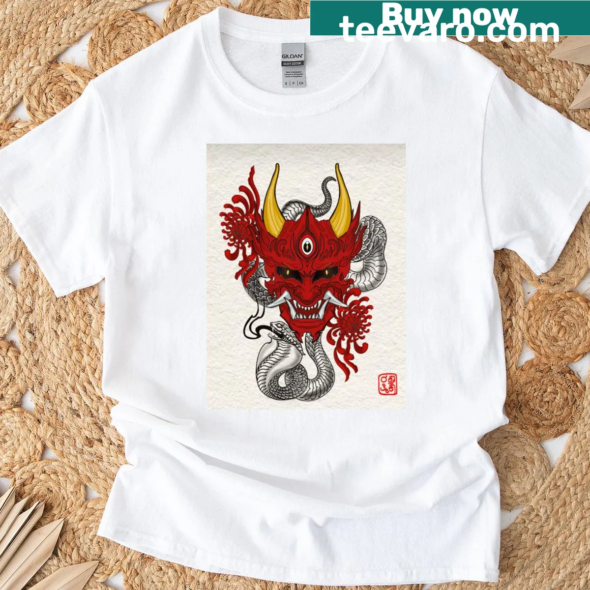 T-shirt featuring an illustrated Oni mask design — on a men's t-shirt