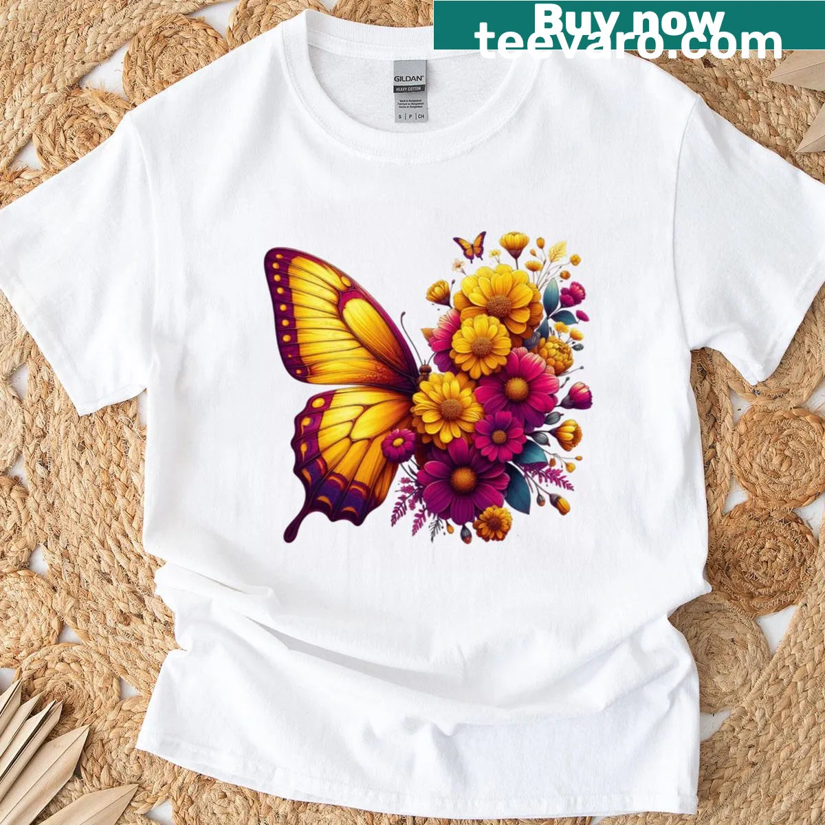 Illustrated T-shirt with golden wings on a magenta background — on a men's t-shirt