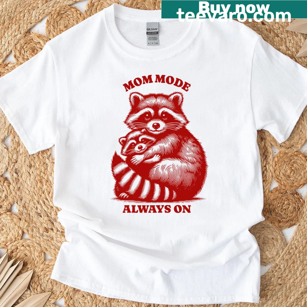 Cute raccoon hugging 'Mom' text in playful illustration style — on a men's t-shirt