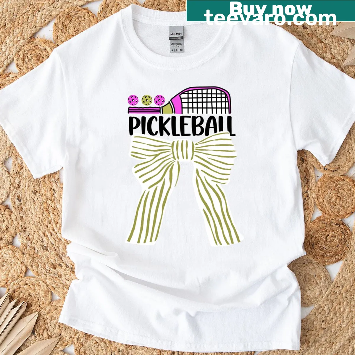 Playful pickleball T-shirt with stripes and a cute bow design. — on a men's t-shirt