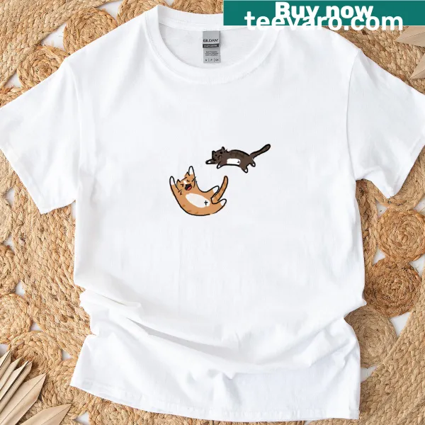 Fun graphic t-shirt featuring playful cats in a whimsical design