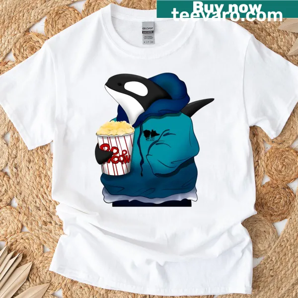 Cartoon T-shirt featuring a killer whale enjoying popcorn