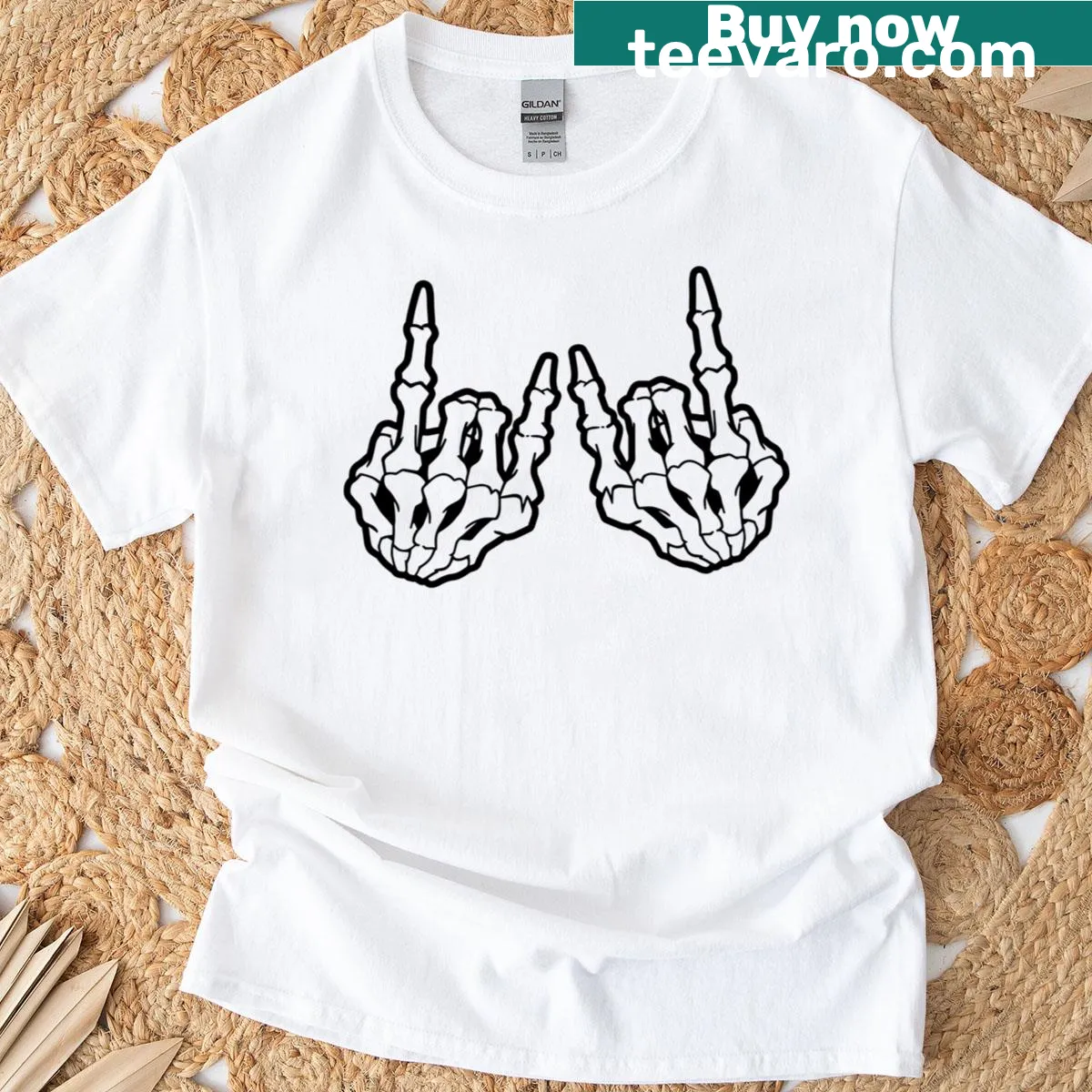 Skeleton hands forming devil horns in a gothic style on T-shirt — on a men's t-shirt