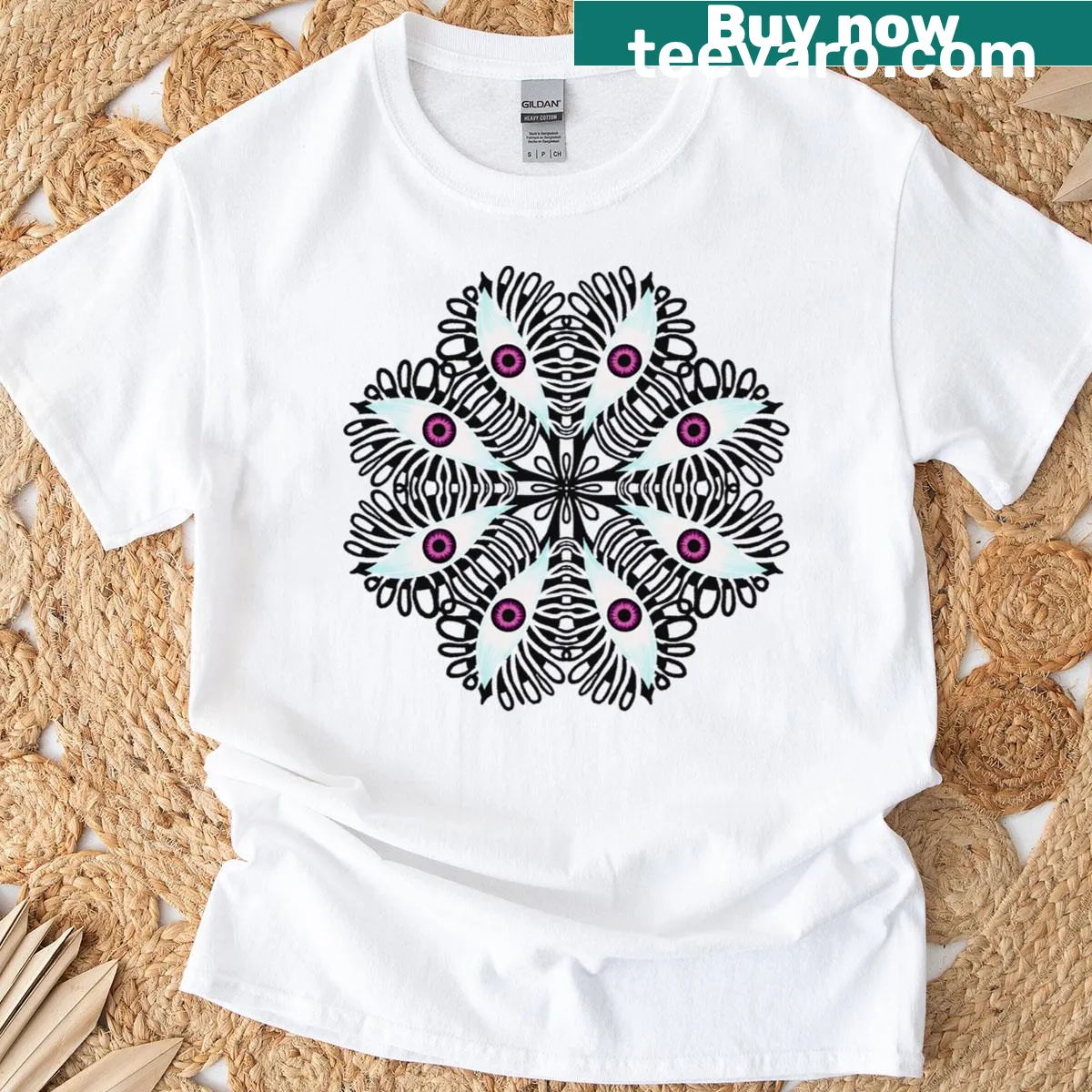 Graphic t-shirt with trippy eye design and pastel goth elements — on a men's t-shirt