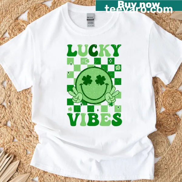 Playful T-shirt with a shamrock smiley face for St. Patrick's Day.