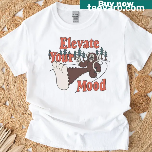 Cartoon T-shirt featuring alpine mountains and camping scenes