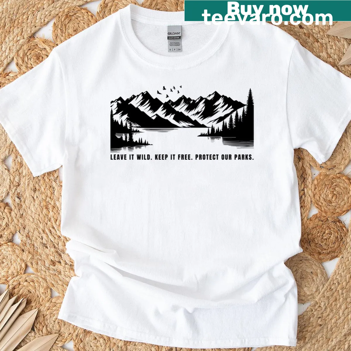 Typography T-shirt with the phrase 'Leave It Wild Keep It Free' — on a men's t-shirt