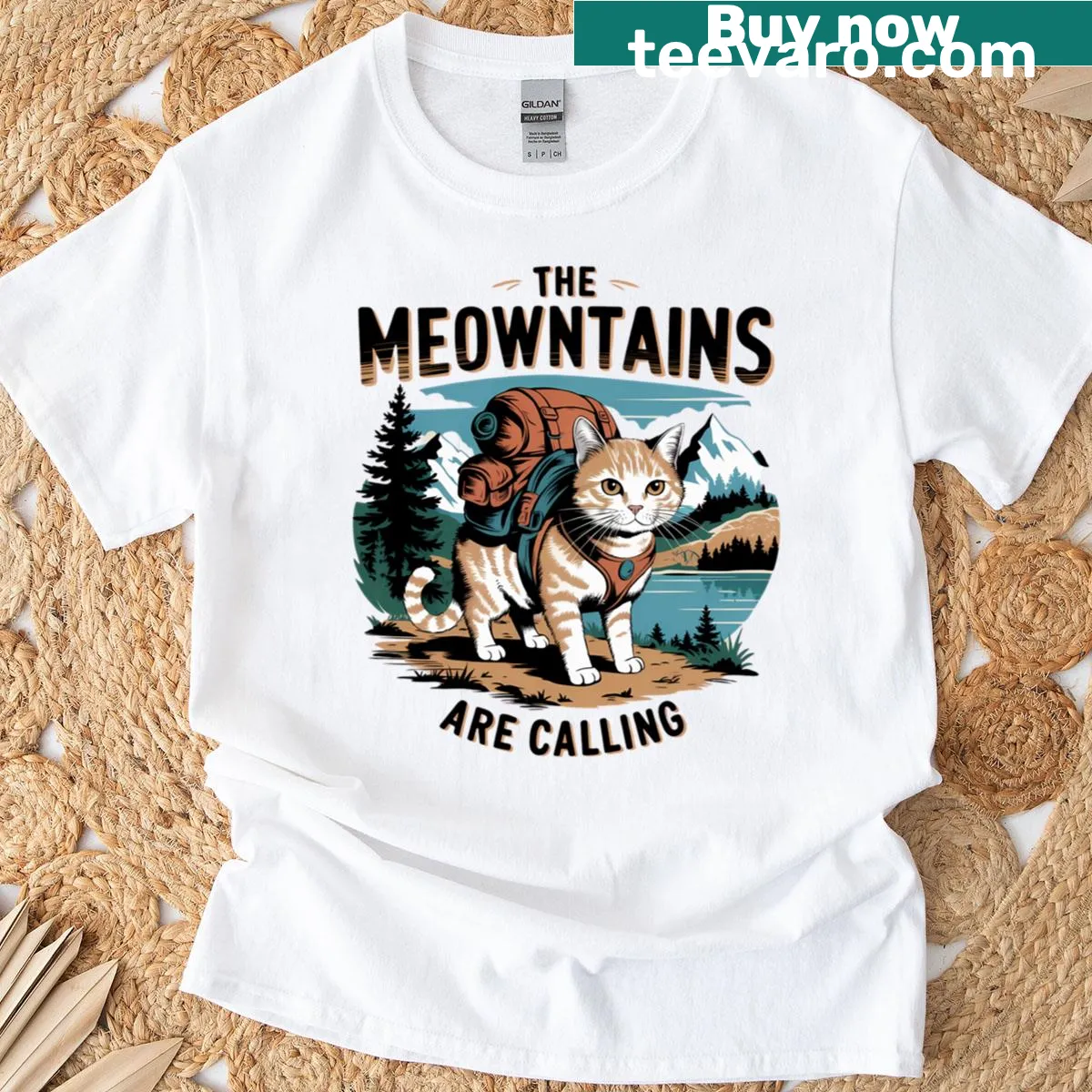 The Meowntains Are Calling cat-themed T-shirt — on a men's t-shirt