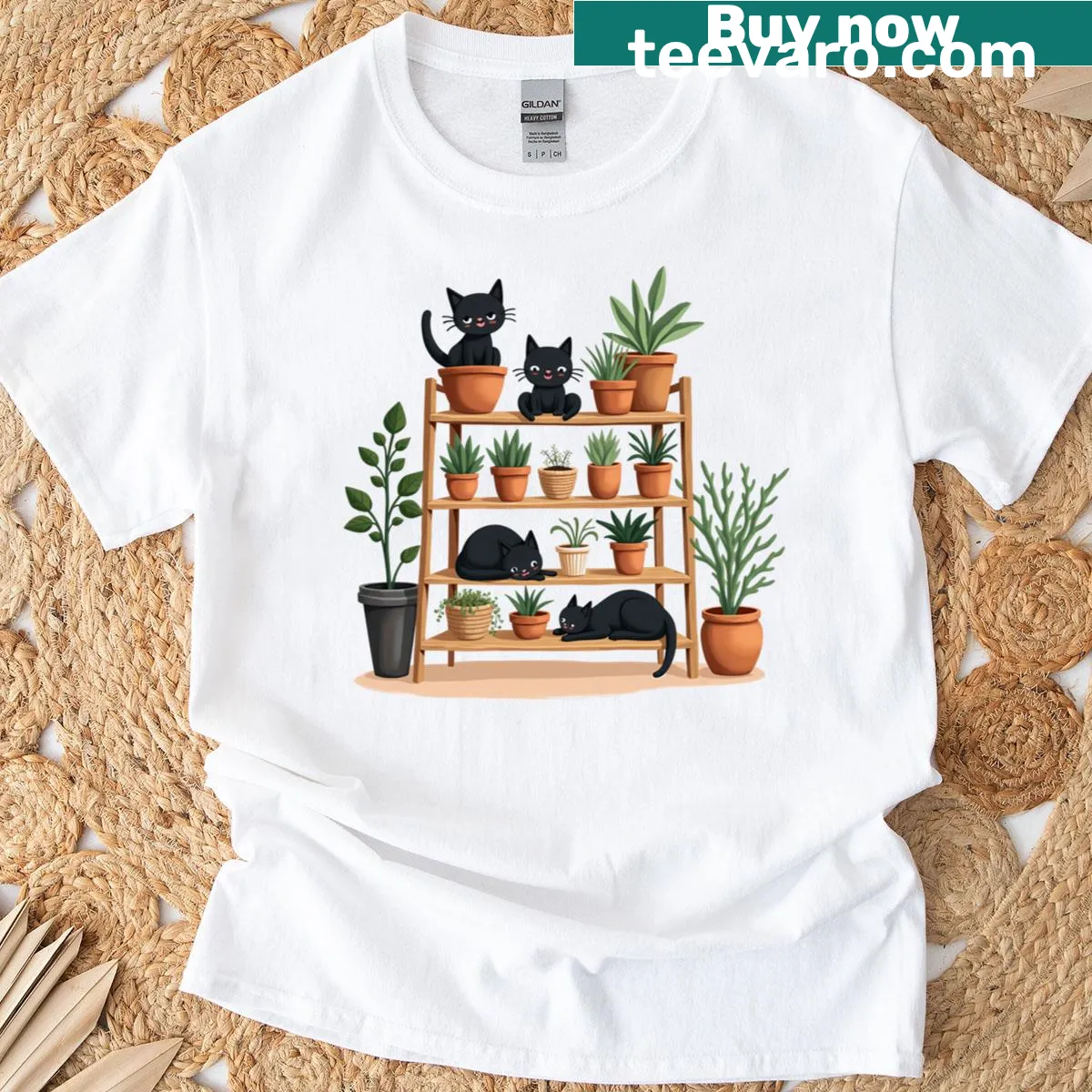 Cartoon graphic of black cats playing on a table on a t-shirt — on a men's t-shirt