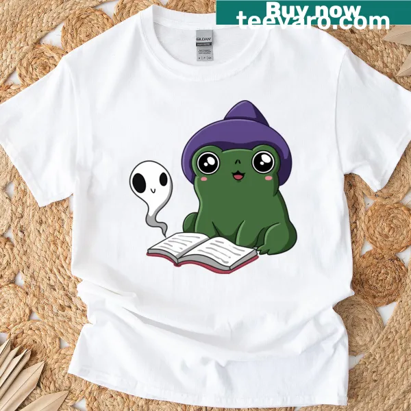 Cute T-shirt featuring a frog with witch accessories