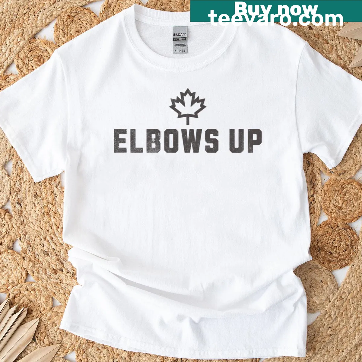 Children's T-shirt featuring a small maple leaf graphic — on a men's t-shirt