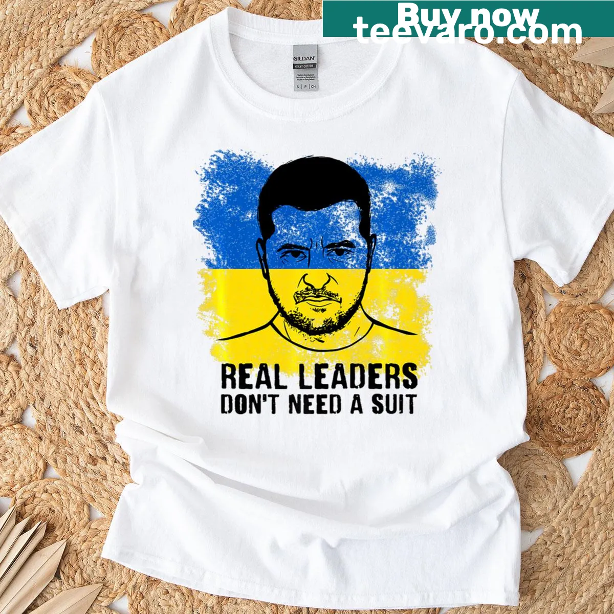 T-shirt with the phrase 'Real Leaders Don't Need A Suit' printed on it — on a men's t-shirt