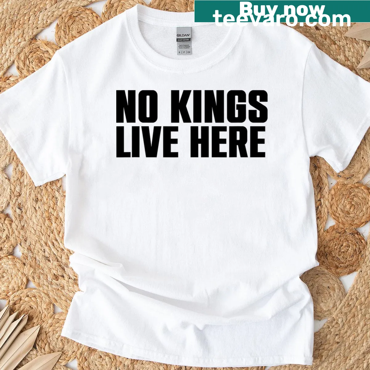 Text design 'No Kings Live Here' on an apparel T-shirt — on a men's t-shirt