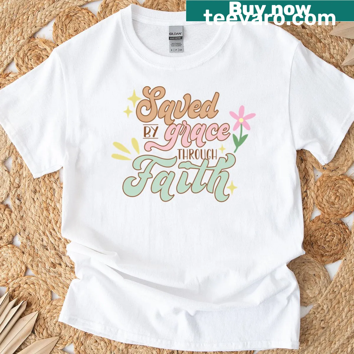 Typographic design featuring the phrase Saved By Grace on a t-shirt — on a men's t-shirt