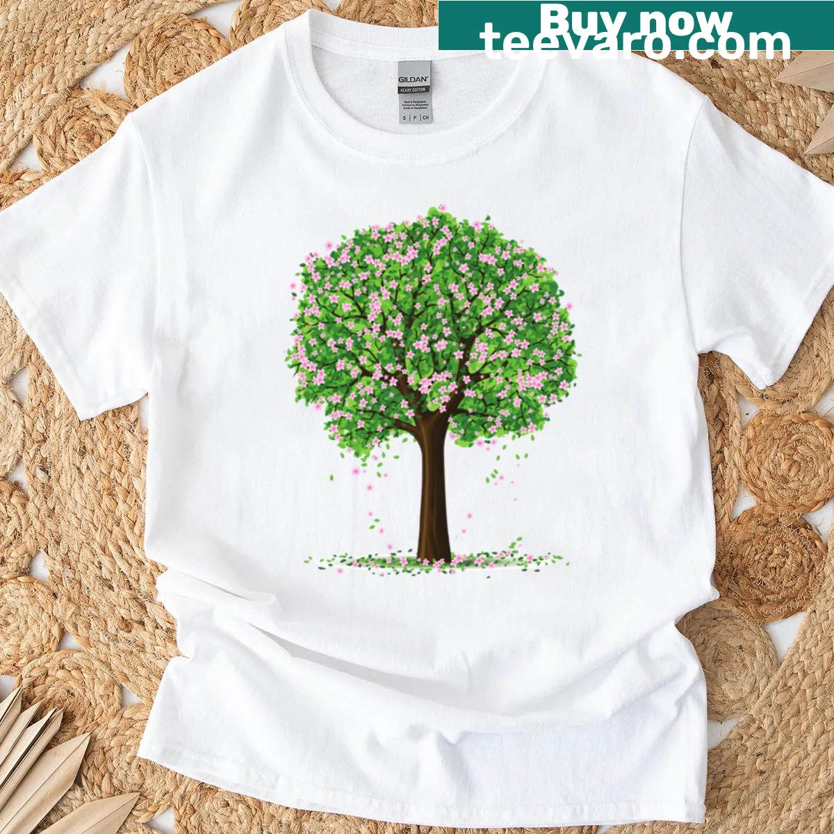Illustrated blooming tree graphic on a spring-themed T-shirt — on a men's t-shirt