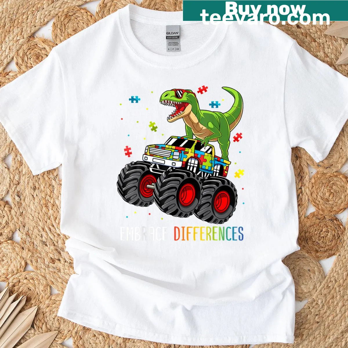 Dinosaur T-rex in a monster truck graphic for kids' autism awareness. — on a men's t-shirt