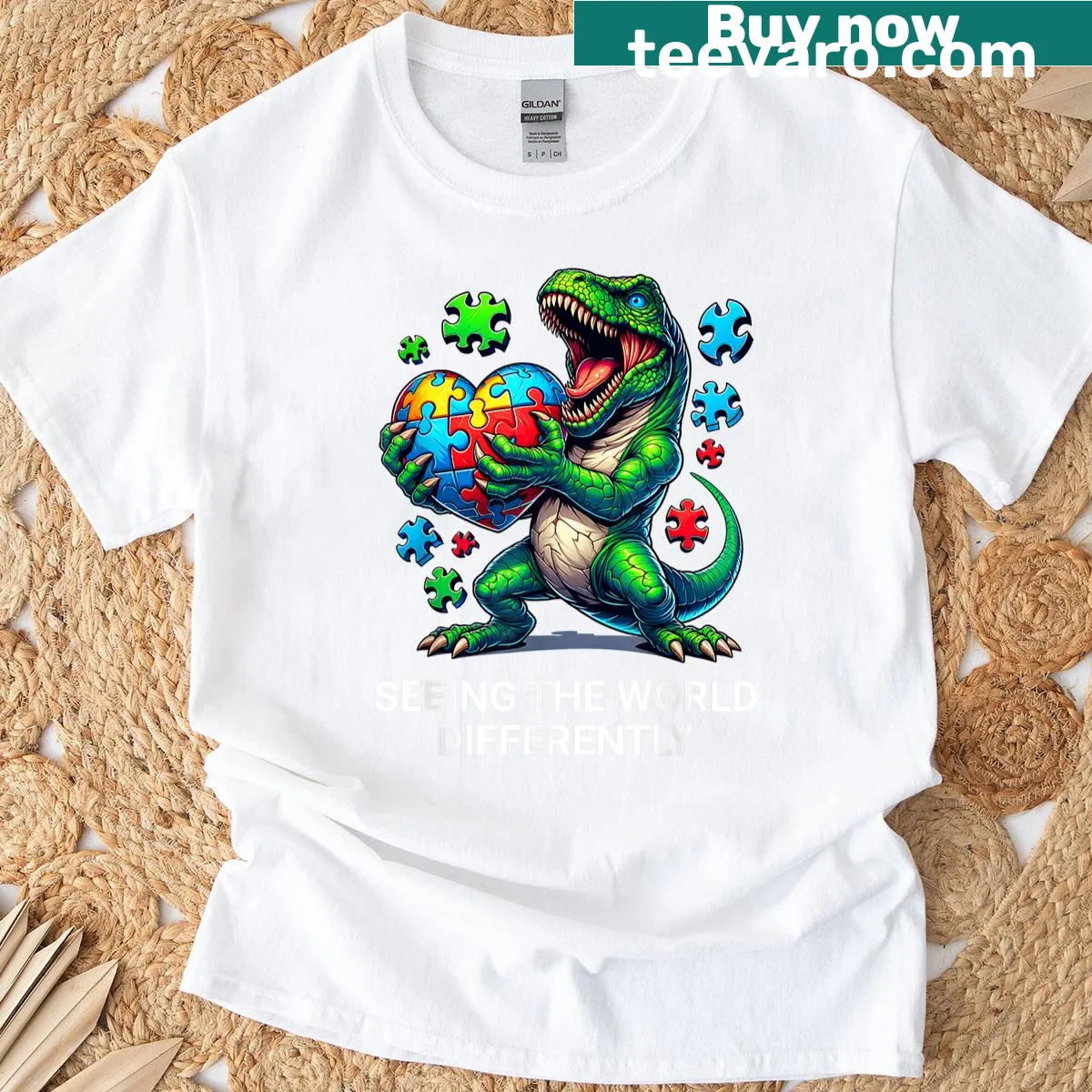 Dinosaur graphic representing autism awareness on a kids' t-shirt. — on a men's t-shirt