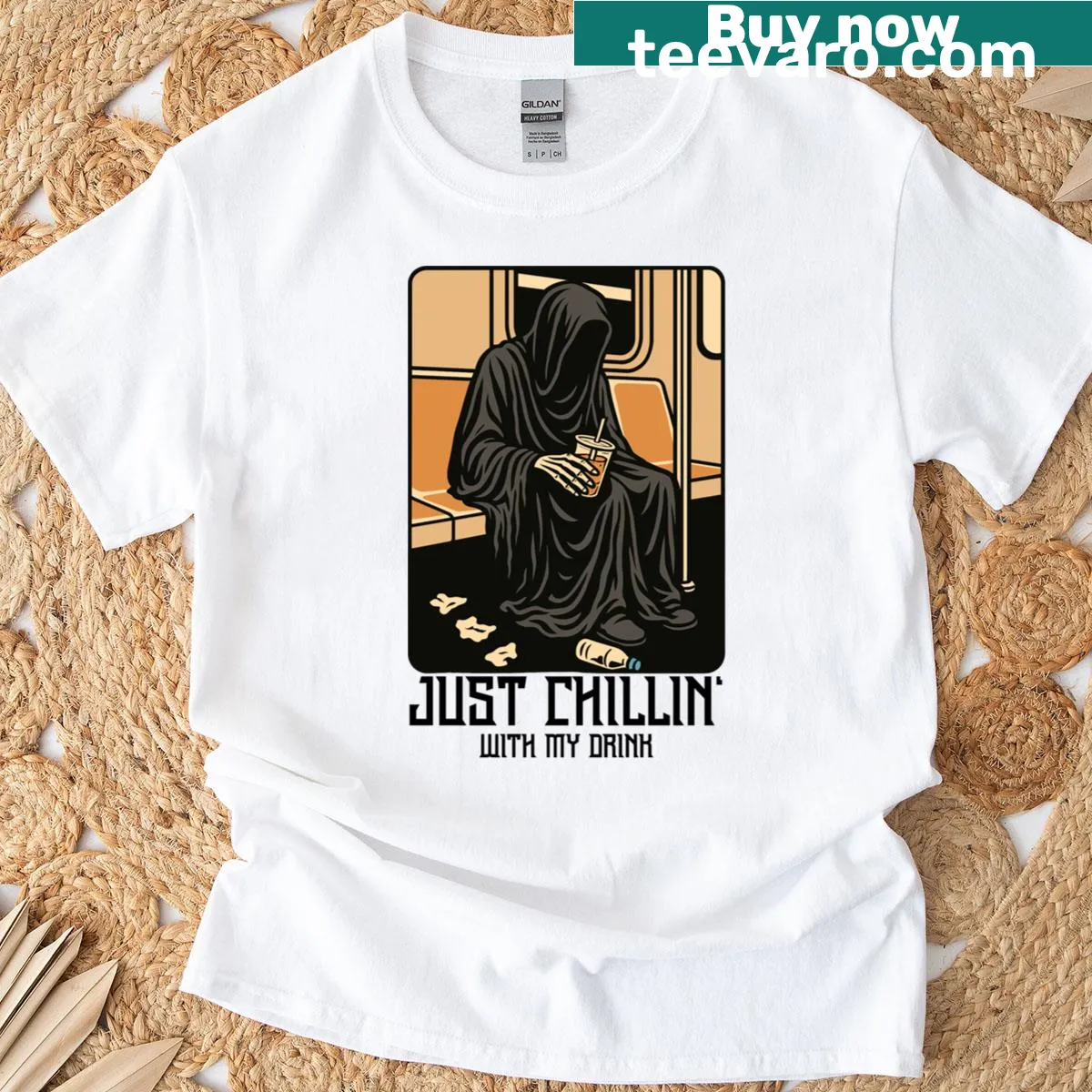 Cartoon T-shirt featuring a relaxed grim reaper with a drink — on a men's t-shirt