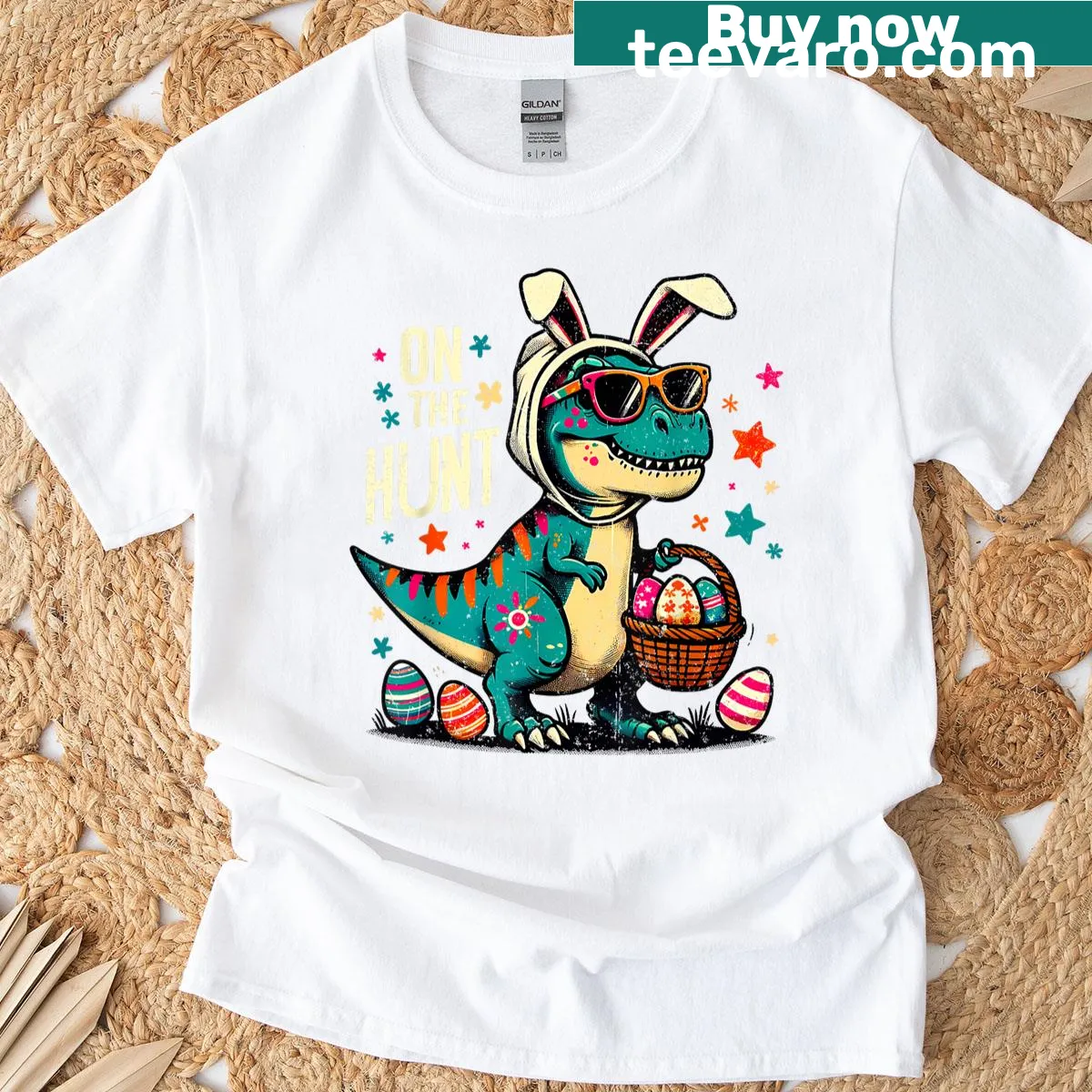 Cartoon T-rex graphic on an Easter-themed T-shirt, featuring an egg hunt. — on a men's t-shirt