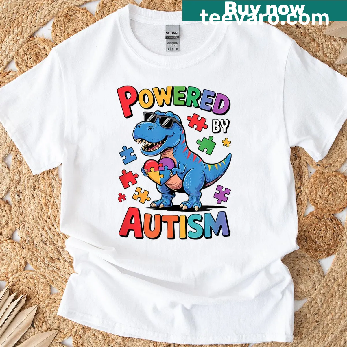 Cute dinosaur graphic made of puzzle pieces for autism awareness. — on a men's t-shirt