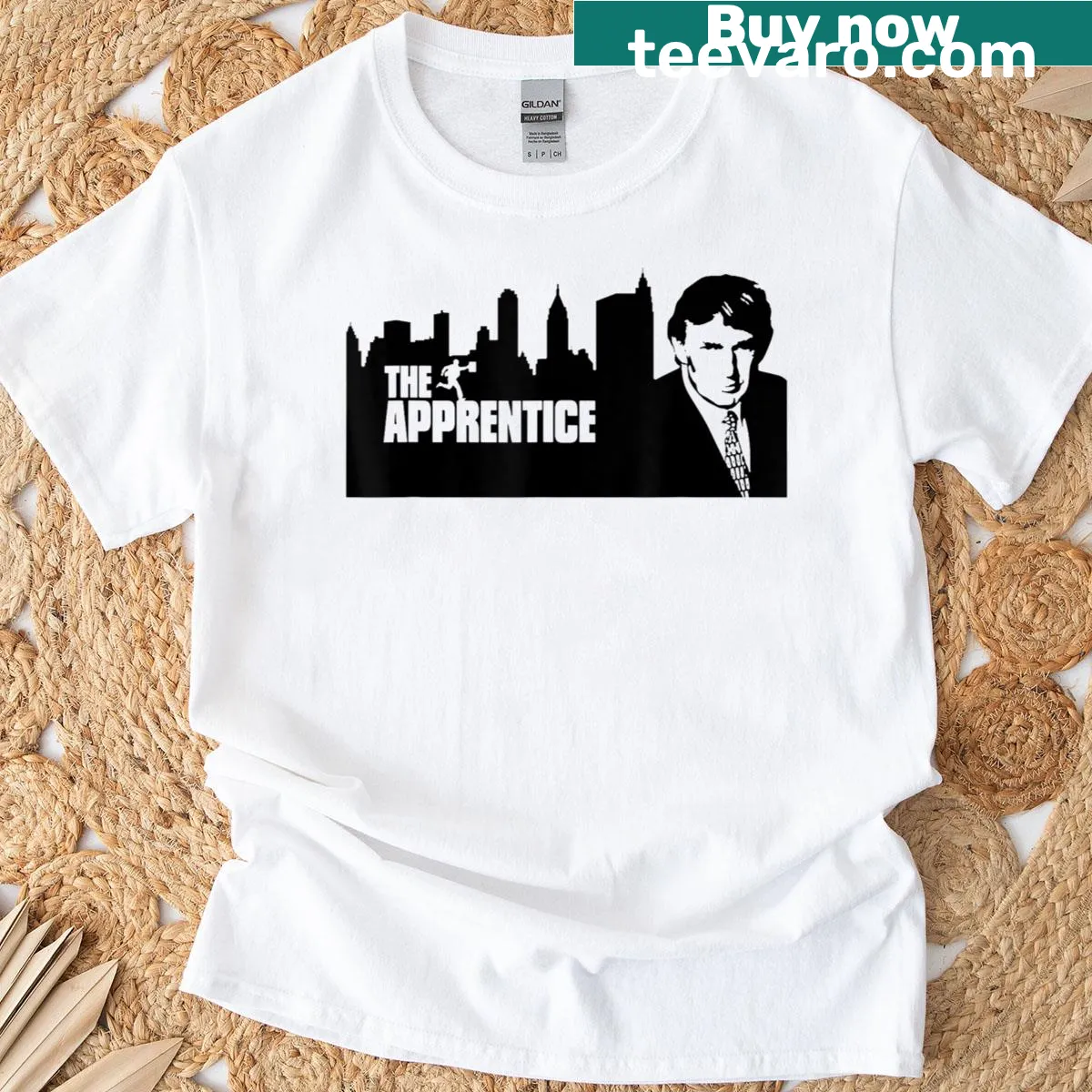 T-shirt featuring skyline design and 'The Apprentice' text — on a men's t-shirt