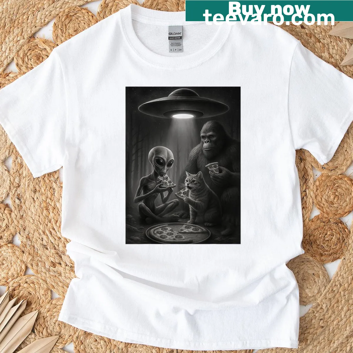 Funny graphic of a cat, alien, and Bigfoot eating pizza together — on a men's t-shirt