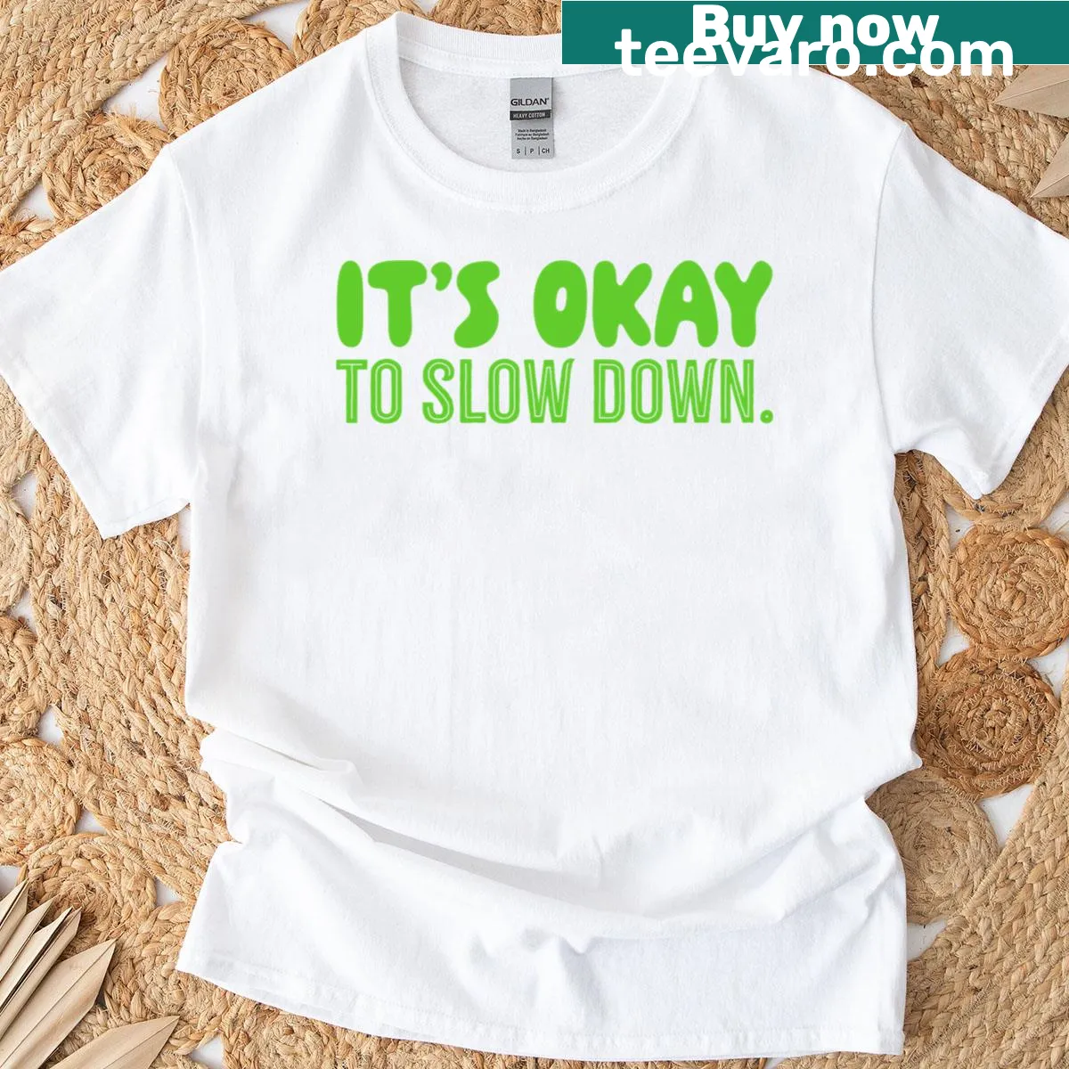 Green t-shirt with a comforting 'It's Okay To Slow Down' message — on a men's t-shirt