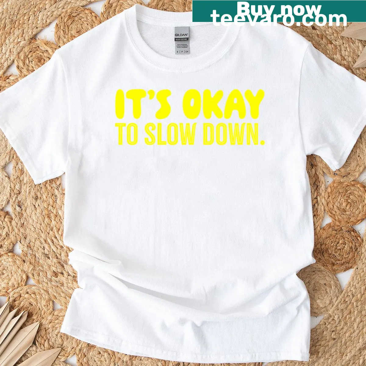 Sunshine t-shirt with a positive 'It's Okay To Slow Down' message — on a men's t-shirt