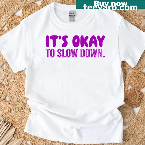 Violet t-shirt featuring a calming 'It's Okay To Slow Down' message