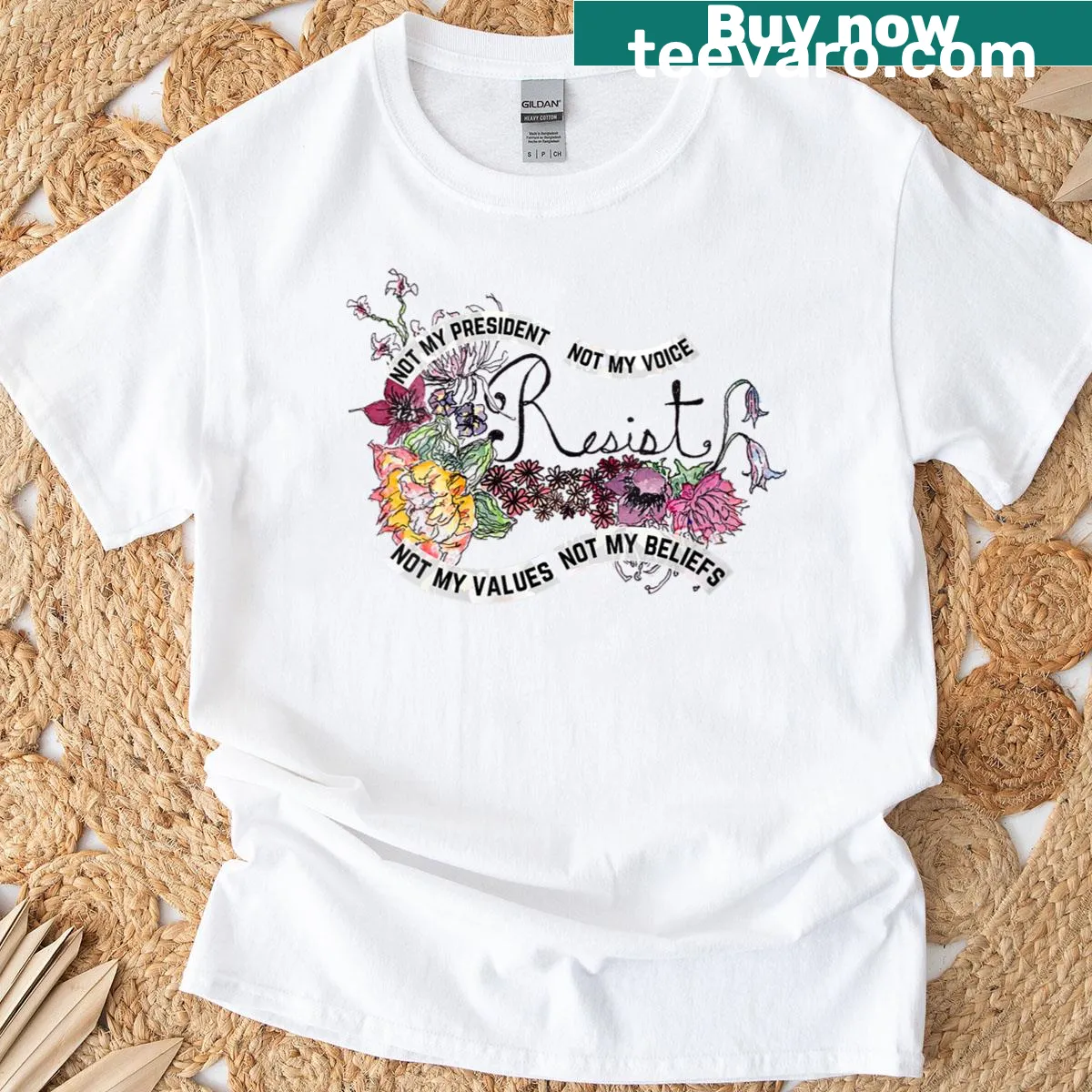 Womens T-shirt with floral design and anti-Trump message — on a men's t-shirt