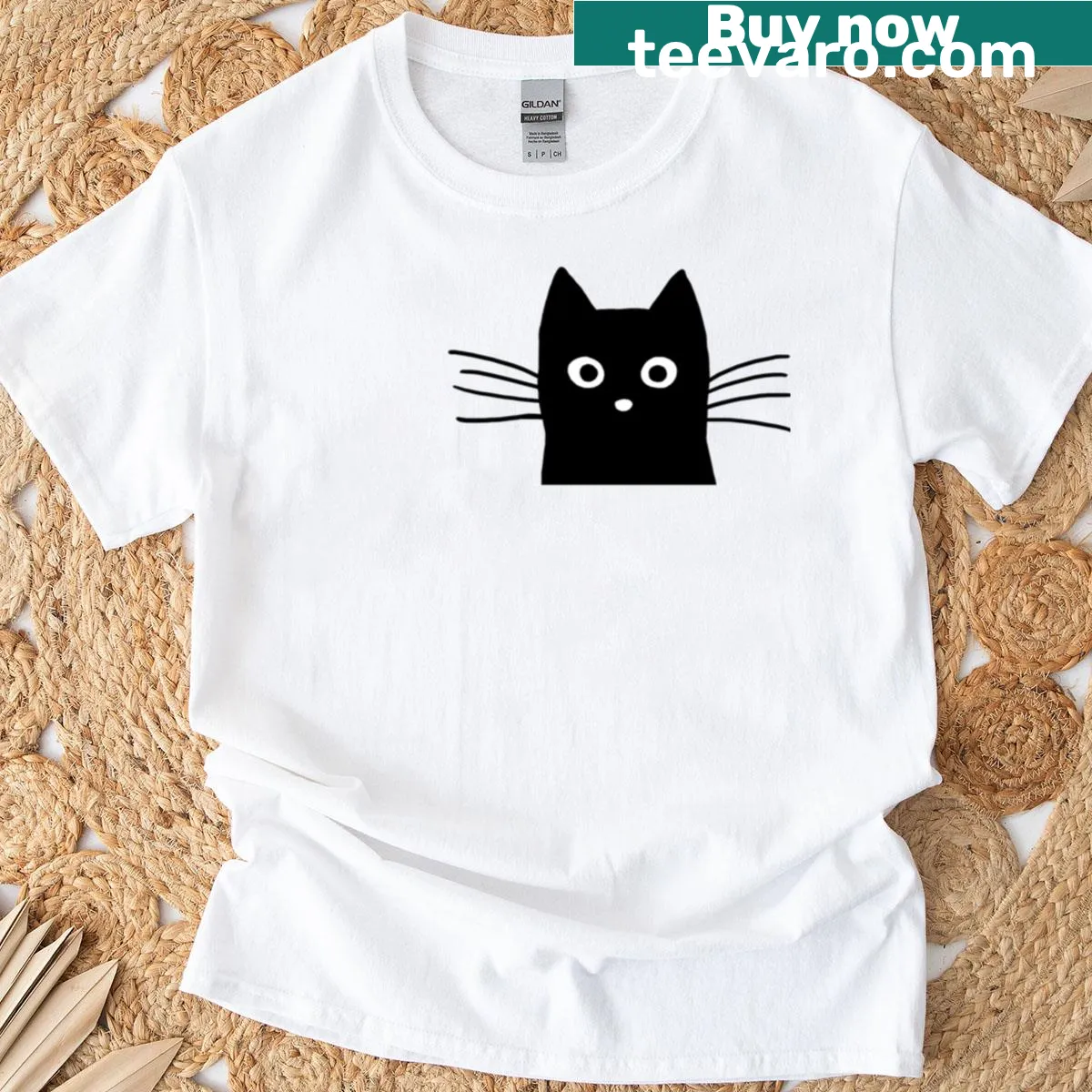 Cartoon black cat face graphic on a T-shirt — on a men's t-shirt