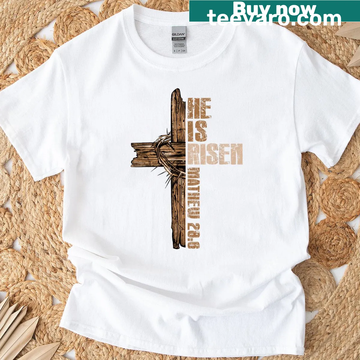 Christian Easter t-shirt with cross and 'He Is Risen' text — on a men's t-shirt