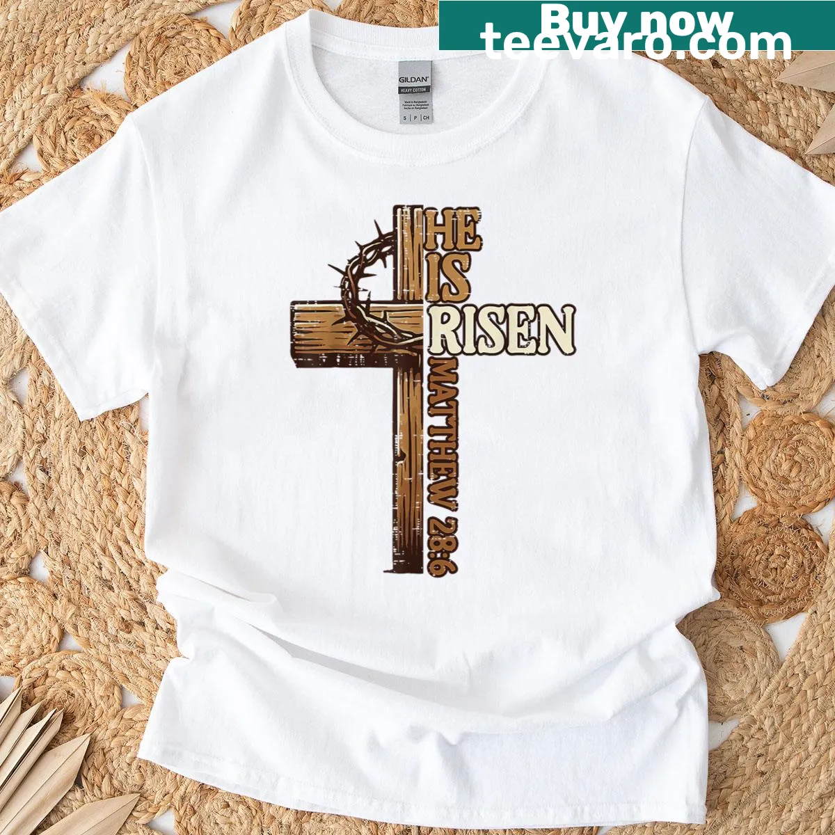 Christian Easter t-shirt with cross and text 'He Is Risen' — on a men's t-shirt