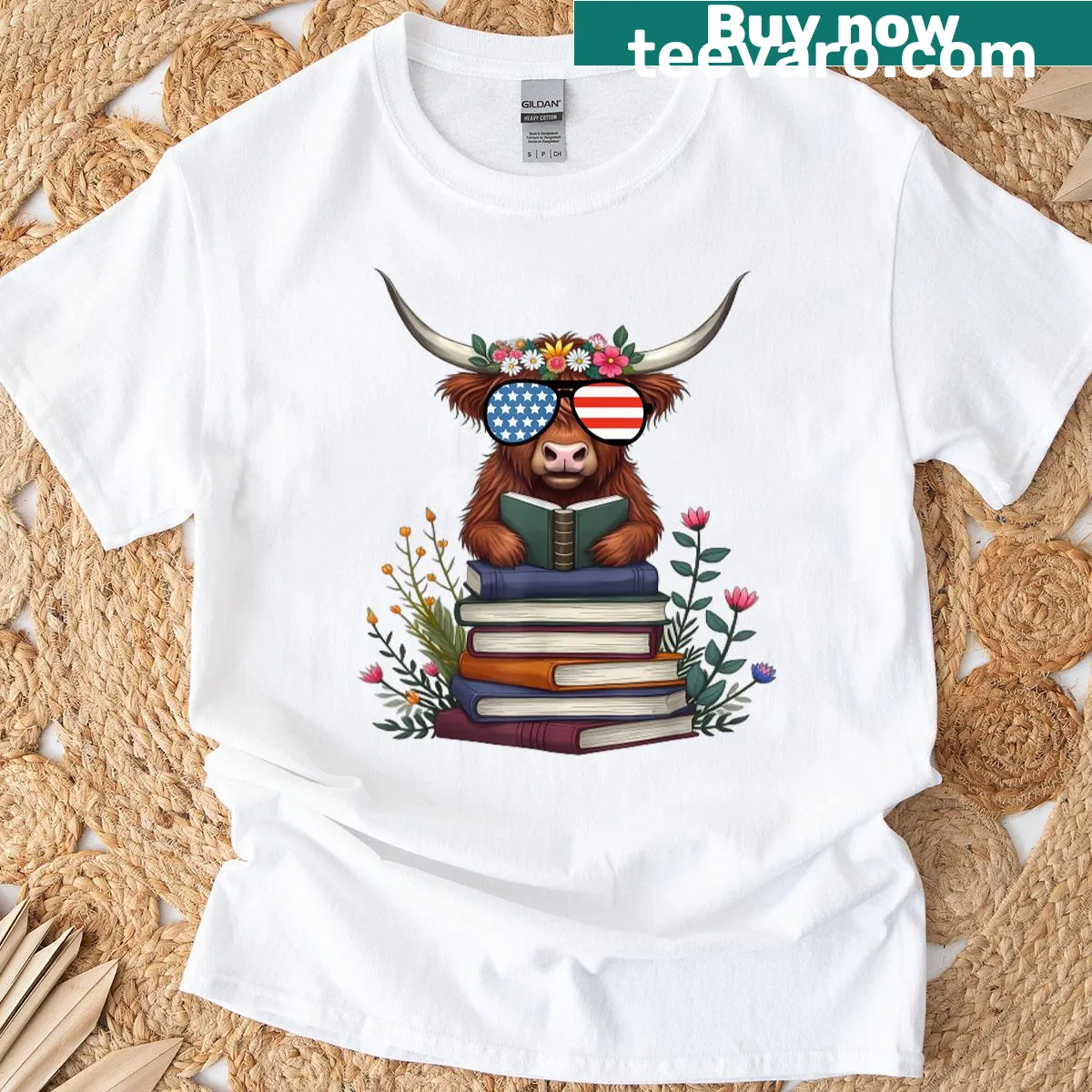 Highland cow with flowers and books for Fourth of July t-shirt — on a men's t-shirt