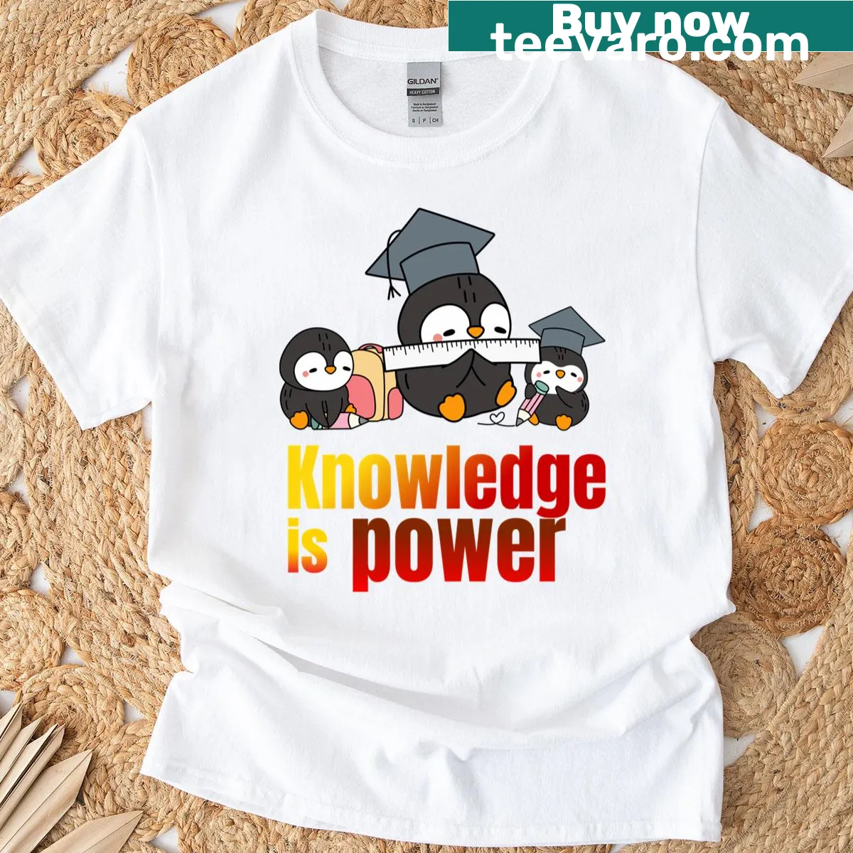 Cute penguin T-shirt with 'Knowledge Is Power' text. — on a men's t-shirt