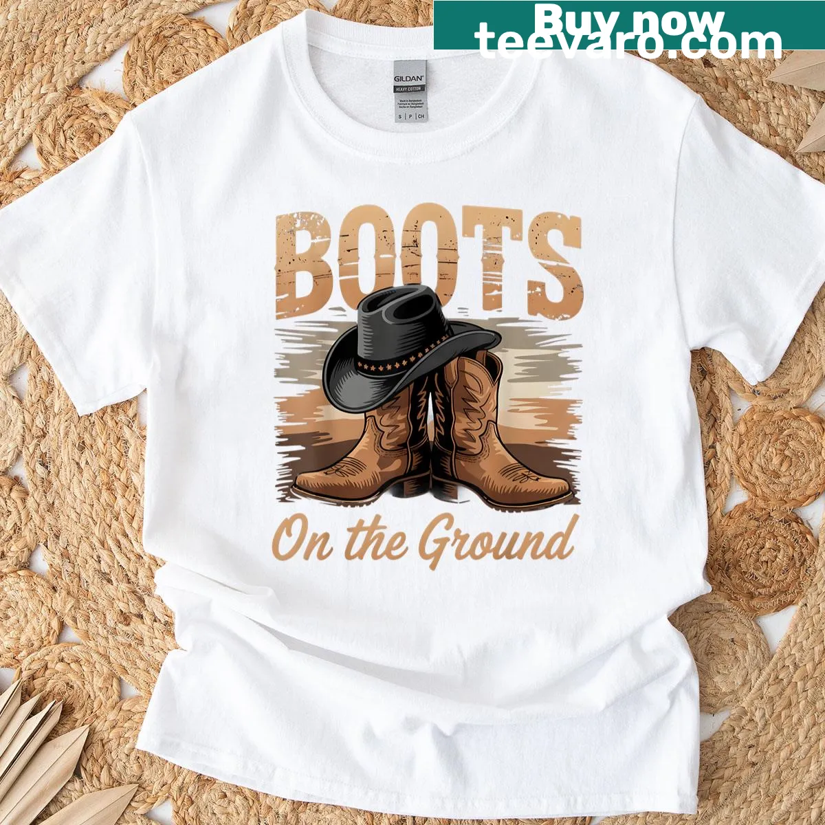 Cowgirl-themed T-shirt featuring 'Boots On The Ground' text — on a men's t-shirt