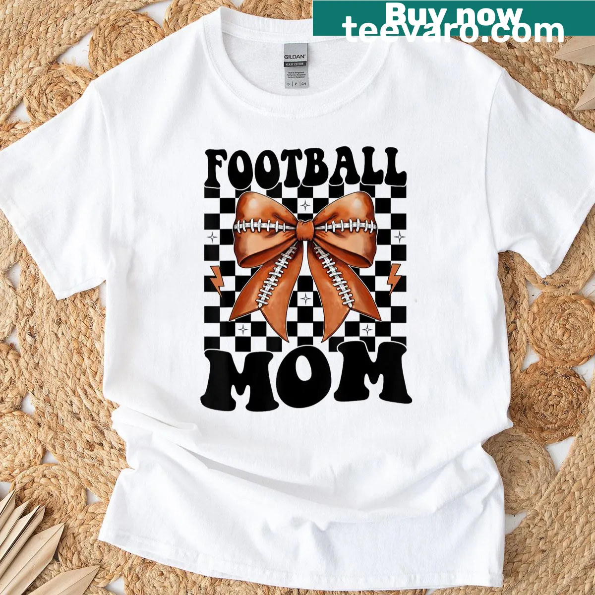 Football mom t-shirt with bow design and supportive text — on a men's t-shirt