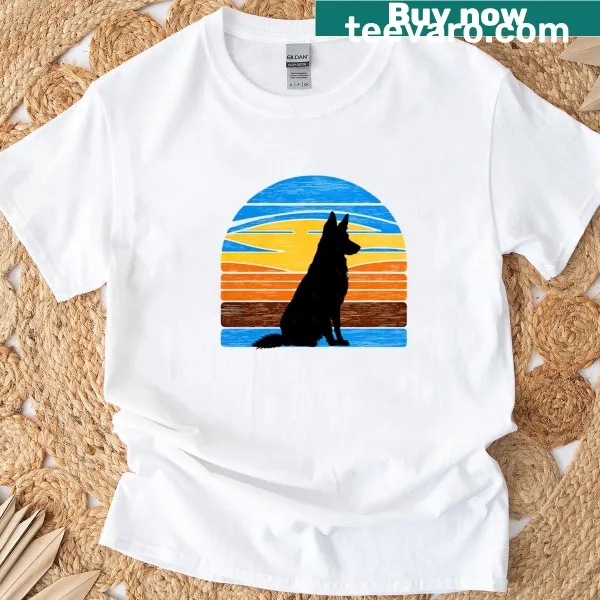 Silhouette of a German Shepherd against a vintage sunset